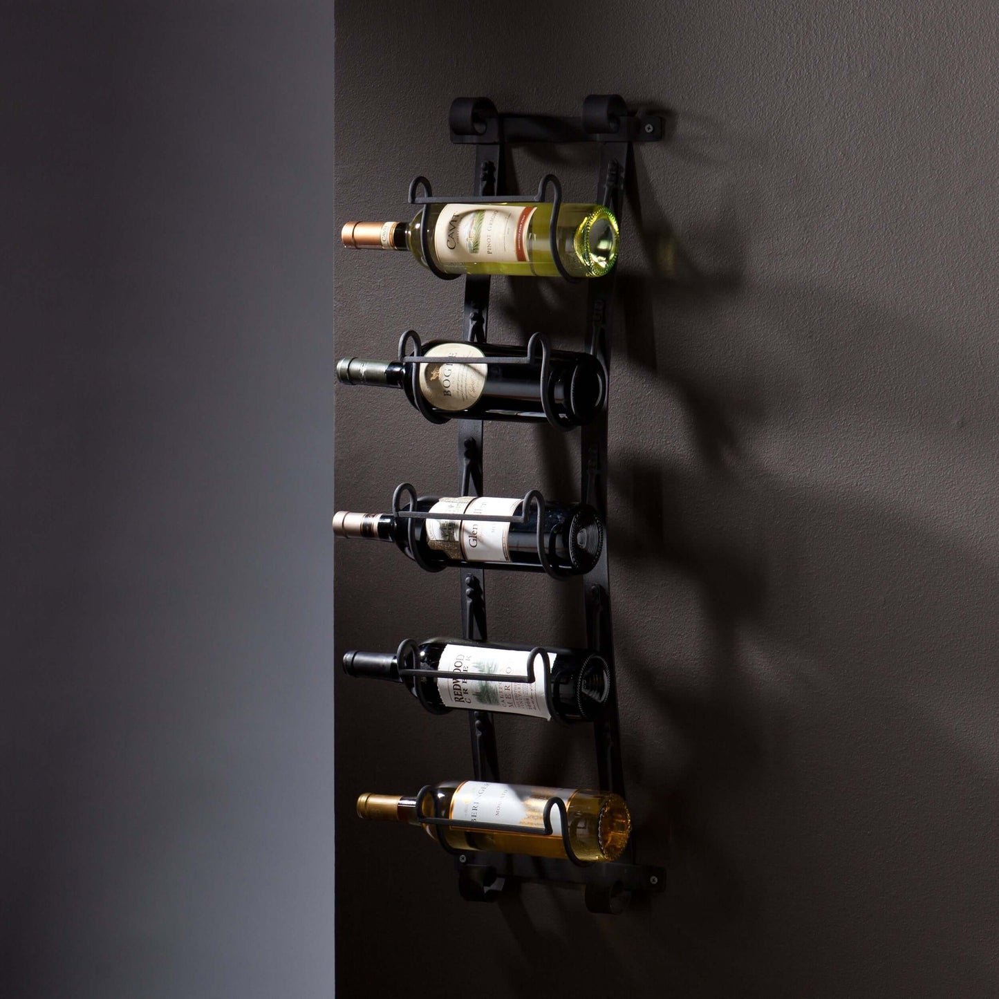 Wellington Wall Mount Wine Rack styled in dining space with wine bottles and glassware