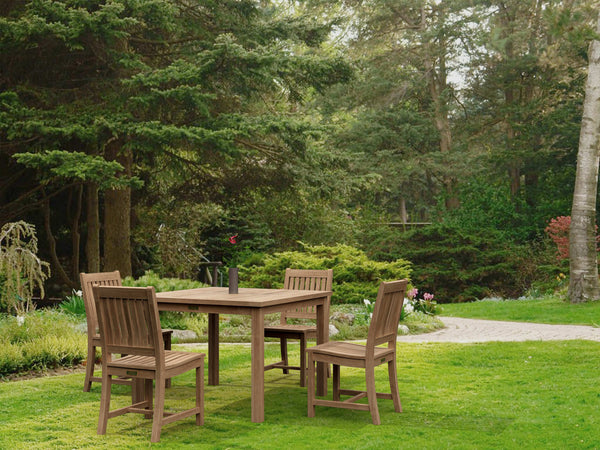 Lisbon 5-piece outdoor dining set with Bahama 42-inch square teak table and four Rialto chairs in garden setting