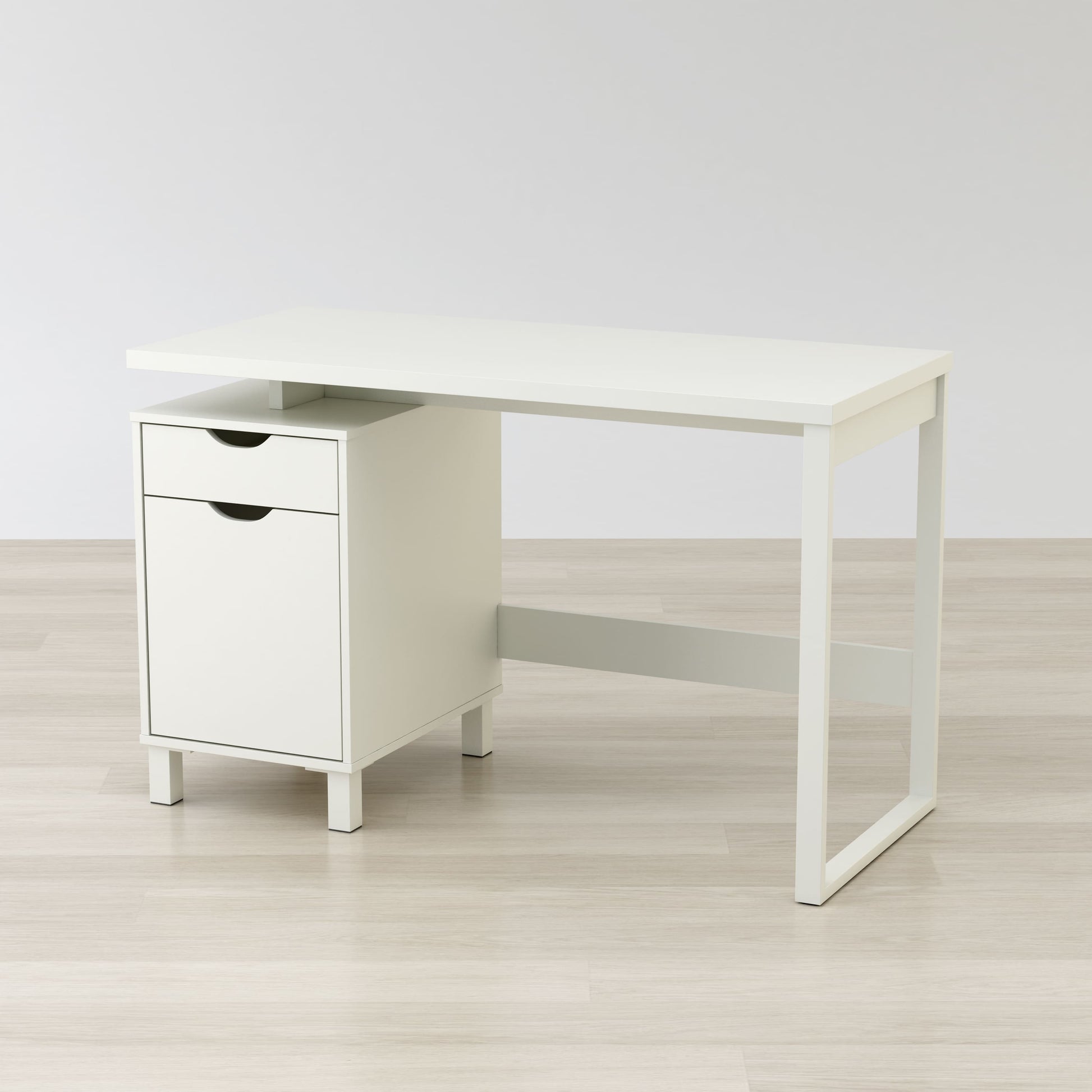 Angled view of L-shaped desk showing workspace and storage compartments