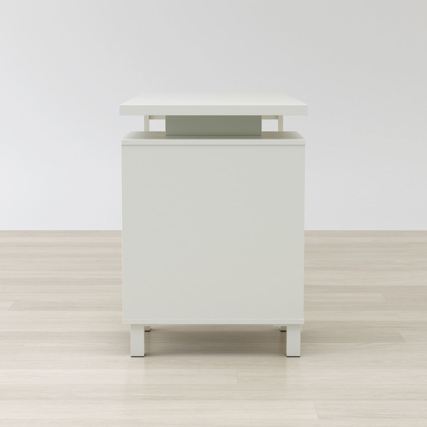 Side view of Haslev desk showing steel frame and finished back panel