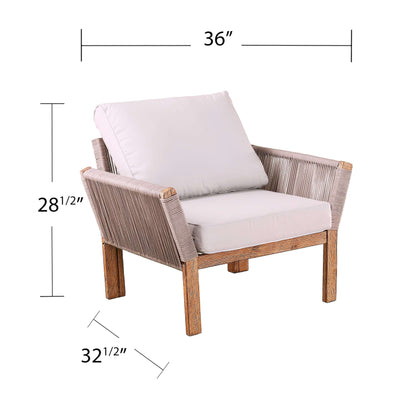 Angled view of Outdoor Armchair with Cushions | Brendina from Bundle Abode with dimensions 